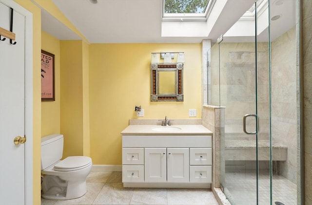 50 Walnut St, Northampton, MA 01060 - bathroom with a skylight, a stall shower, toilet, vanity, and baseboards