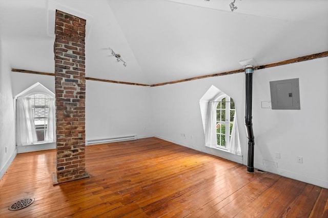 50 Walnut St, Northampton, MA 01060 - unfurnished living room with electric panel, lofted ceiling, baseboard heating, wood-type flooring, and baseboards