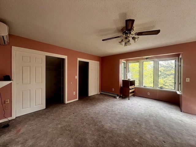 40 Papoose Lake Dr, Heath, MA 01346 - unfurnished bedroom with a baseboard heating unit, a textured ceiling, carpet floors, multiple closets, and a ceiling fan
