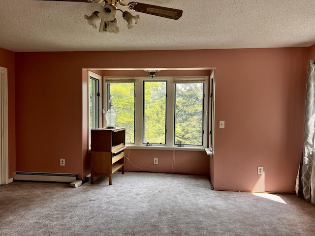 40 Papoose Lake Dr, Heath, MA 01346 - carpeted spare room featuring a baseboard radiator, ceiling fan, and a textured ceiling