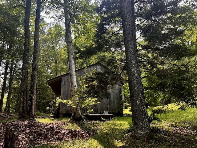 40 Papoose Lake Dr, Heath, MA 01346 - view of property exterior featuring an outdoor structure and a wooded view
