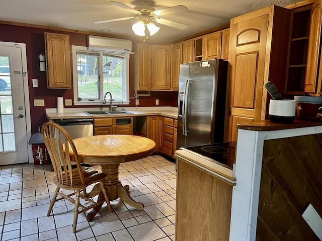 40 Papoose Lake Dr, Heath, MA 01346 - kitchen with a sink, appliances with stainless steel finishes, a wall unit AC, and plenty of natural light