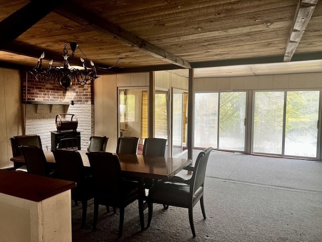 40 Papoose Lake Dr, Heath, MA 01346 - sunroom / solarium with wooden ceiling with exposed beams, a wood stove, a chandelier, plenty of natural light, and carpet