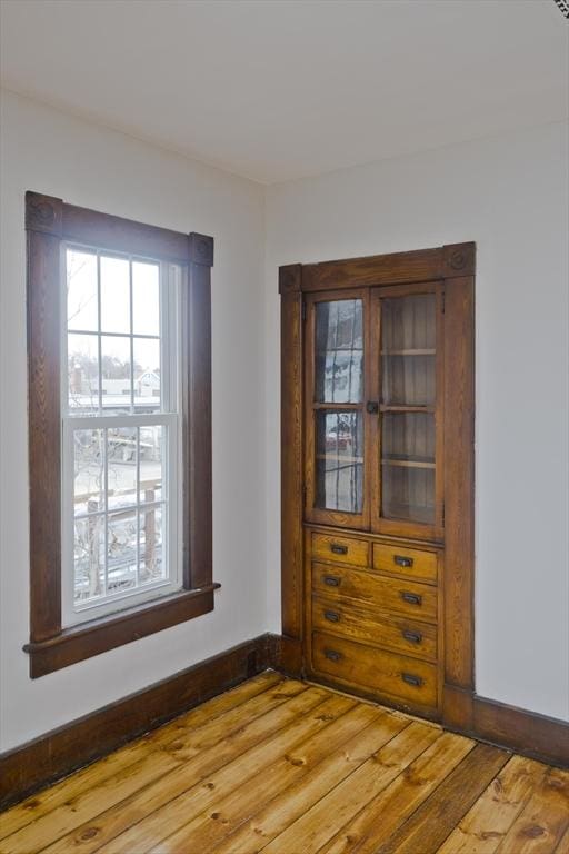 spare room with hardwood / wood-style floors