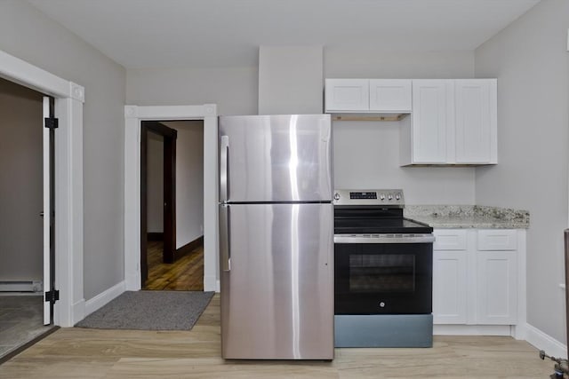 kitchen featuring light hardwood / wood-style floors, a baseboard radiator, stainless steel appliances, and white cabinetry