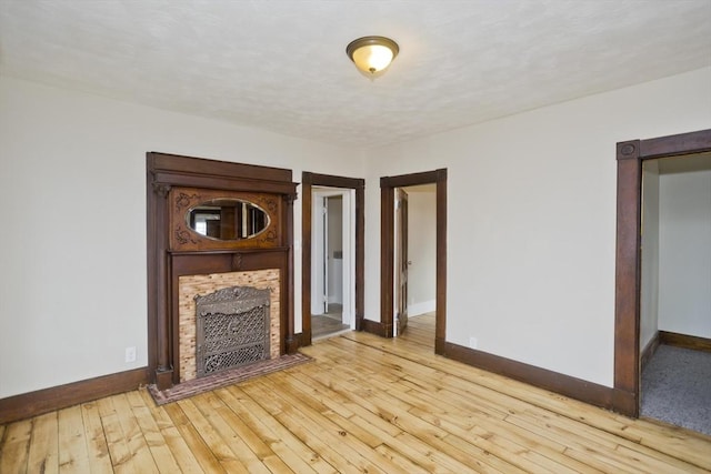 unfurnished living room with light wood-type flooring