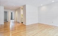 306 Columbus Ave Unit 2, Boston, MA 02116 - empty room with wood finished floors, baseboards, and recessed lighting