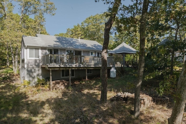 rear view of house featuring a deck