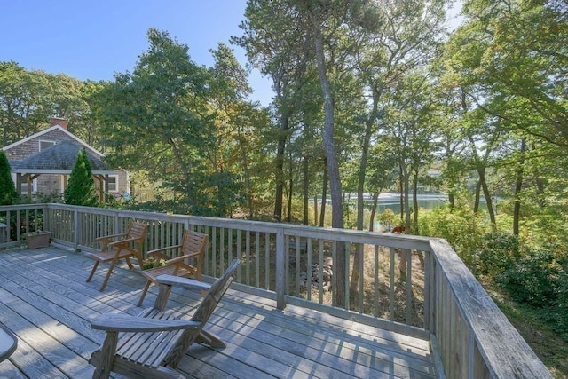 wooden terrace with a water view