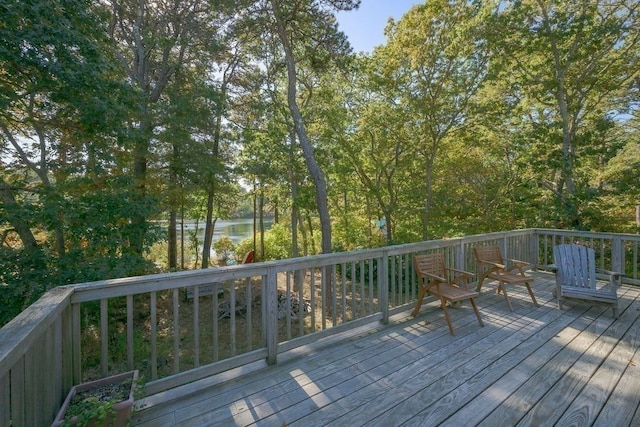 wooden deck featuring a water view