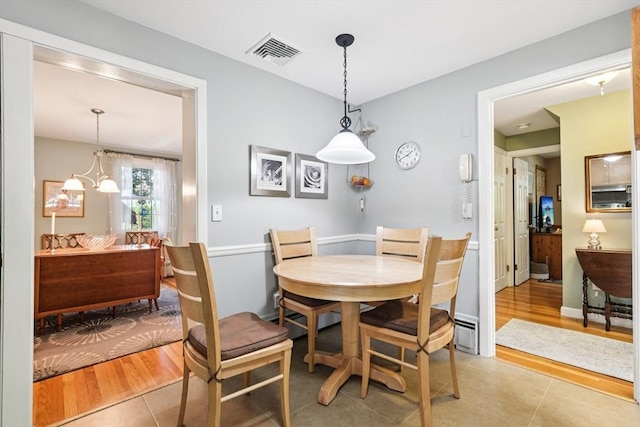 56 Conrad Rd, Melrose, MA 02176 - dining room with light tile patterned floors and baseboard heating