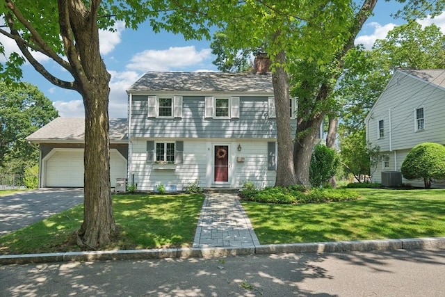 56 Conrad Rd, Melrose, MA 02176 - colonial home featuring a chimney, driveway, an attached garage, and a front yard