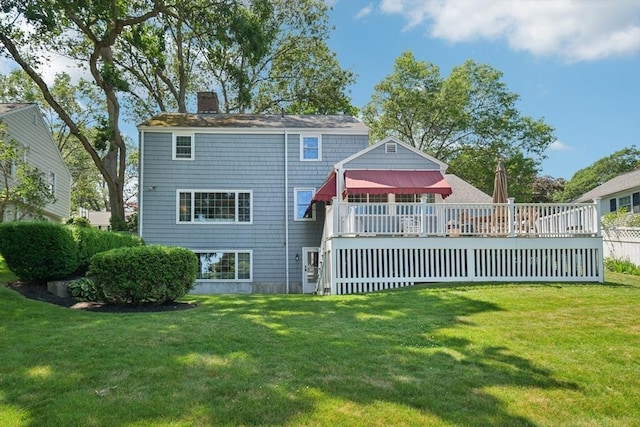 56 Conrad Rd, Melrose, MA 02176 - back of house featuring a chimney, a yard, and a deck