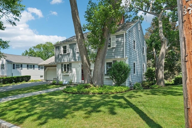 56 Conrad Rd, Melrose, MA 02176 - colonial-style house with an attached garage, a front yard, and asphalt driveway