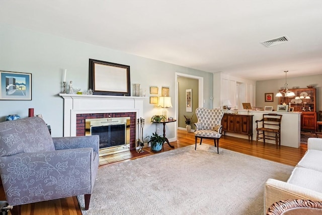 56 Conrad Rd, Melrose, MA 02176 - living area with wood finished floors and a fireplace