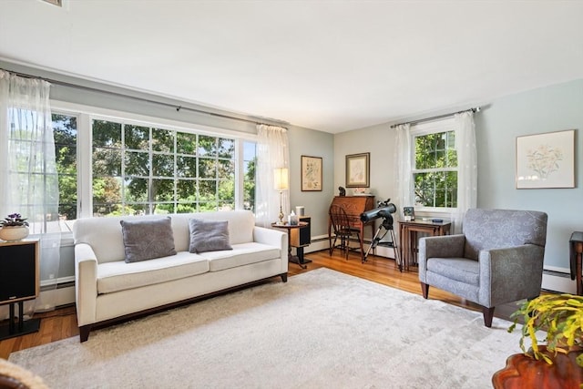 56 Conrad Rd, Melrose, MA 02176 - living area with a baseboard radiator, wood finished floors, and baseboard heating