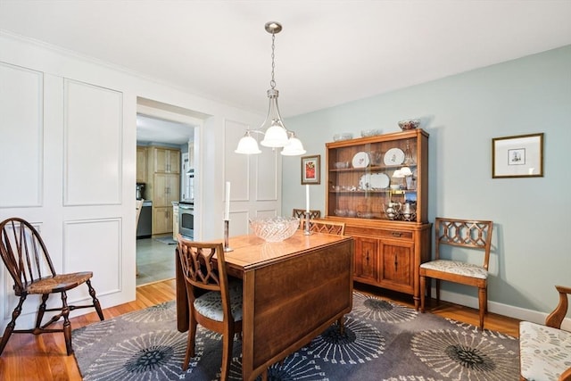 56 Conrad Rd, Melrose, MA 02176 - dining space featuring wood finished floors and baseboards