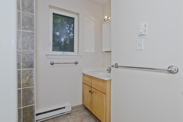 11 Arbor Way Unit C, Holyoke, MA 01040 - bathroom with a baseboard radiator and vanity