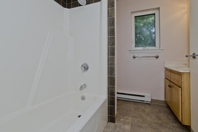 11 Arbor Way Unit C, Holyoke, MA 01040 - full bath with baseboard heating, vanity, and tub / shower combination