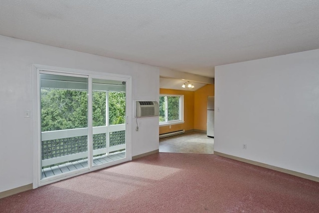 11 Arbor Way Unit C, Holyoke, MA 01040 - carpeted empty room featuring a baseboard radiator, an AC wall unit, and a textured ceiling