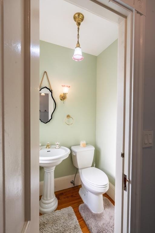 37 Chestnut St, Stoneham, MA 02180 - bathroom with wood finished floors, toilet, and baseboards