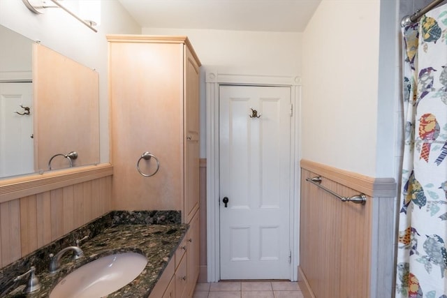 37 Chestnut St, Stoneham, MA 02180 - bathroom featuring vanity, tile patterned floors, wainscoting, curtained shower, and wooden walls