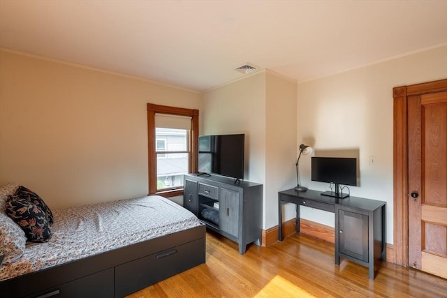 37 Chestnut St, Stoneham, MA 02180 - bedroom with light wood finished floors, crown molding, and baseboards