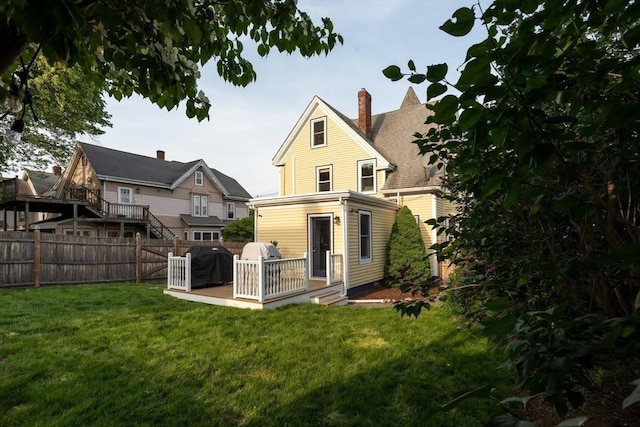 37 Chestnut St, Stoneham, MA 02180 - rear view of property featuring a deck and a chimney