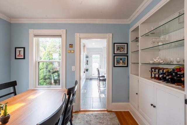 37 Chestnut St, Stoneham, MA 02180 - dining room with wood finished floors, crown molding, and baseboards
