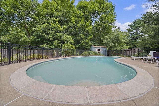 view of swimming pool with a patio area, a fenced backyard, and a fenced in pool