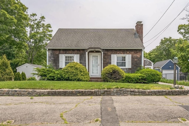 521 Pleasant St, Weymouth, MA 02190 - cape cod house featuring a chimney and roof with shingles
