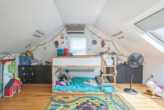 521 Pleasant St, Weymouth, MA 02190 - bedroom with wood finished floors, radiator heating unit, an AC wall unit, and lofted ceiling