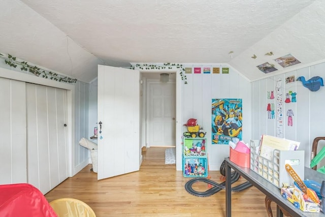 521 Pleasant St, Weymouth, MA 02190 - bedroom featuring vaulted ceiling, light wood-style flooring, a textured ceiling, and a closet