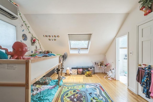 521 Pleasant St, Weymouth, MA 02190 - rec room with wood finished floors, a wall unit AC, vaulted ceiling, and a skylight
