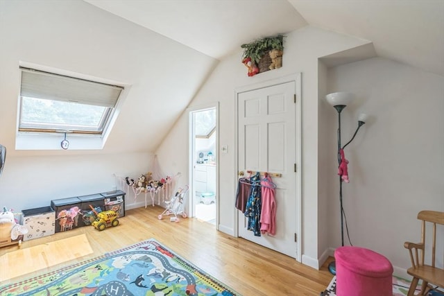 521 Pleasant St, Weymouth, MA 02190 - game room with lofted ceiling, a skylight, and light wood finished floors