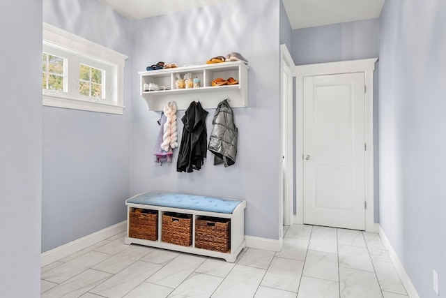 15 Day Lily Ln, Walpole, MA 02081 - mudroom with marble look tile flooring and baseboards