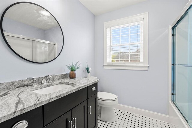 15 Day Lily Ln, Walpole, MA 02081 - full bath featuring baseboards, vanity, toilet, and tile patterned flooring