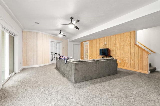15 Day Lily Ln, Walpole, MA 02081 - living area featuring stairway, baseboards, ceiling fan, carpet, and wooden walls