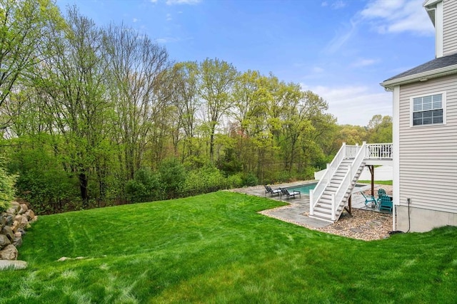 15 Day Lily Ln, Walpole, MA 02081 - view of grassy yard with stairs, an outdoor pool, and a patio area