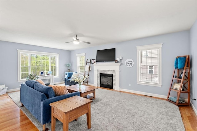 15 Day Lily Ln, Walpole, MA 02081 - living room with a ceiling fan, a fireplace, light wood-style floors, and baseboards