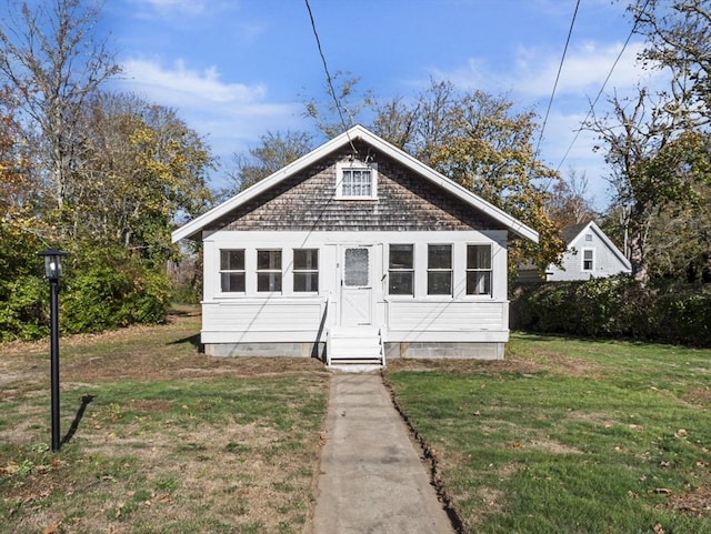 8 Rock Harbor Rd, Orleans, MA 02653 - bungalow-style home with entry steps, a front yard, and crawl space