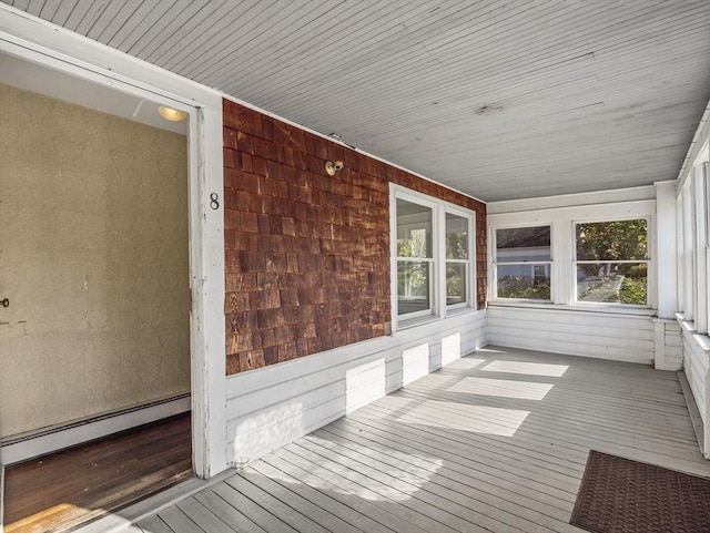 8 Rock Harbor Rd, Orleans, MA 02653 - unfurnished sunroom featuring wood-type flooring, wood walls, a baseboard radiator, and wooden ceiling