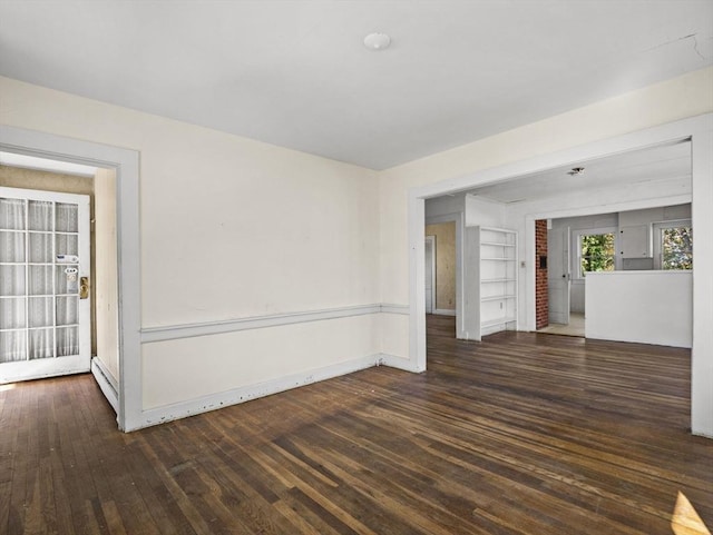 8 Rock Harbor Rd, Orleans, MA 02653 - unfurnished room featuring wood finished floors, built in features, and baseboards