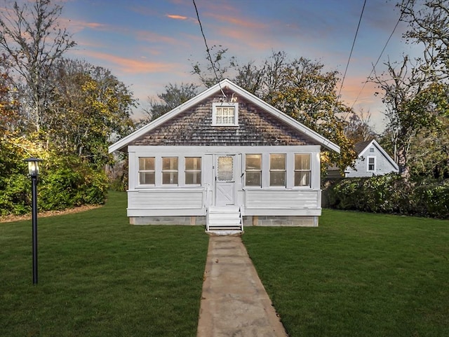 8 Rock Harbor Rd, Orleans, MA 02653 - view of front facade featuring a front lawn and entry steps