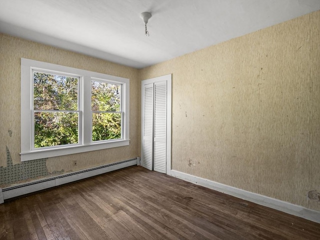 8 Rock Harbor Rd, Orleans, MA 02653 - empty room featuring a baseboard heating unit, wood finished floors, and baseboards
