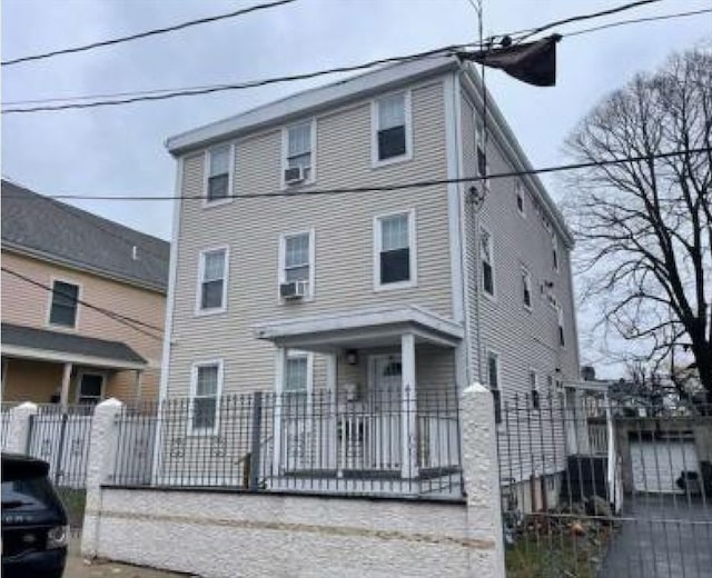 front facade featuring cooling unit and a porch