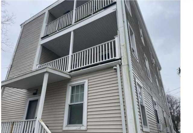 view of property exterior with a balcony