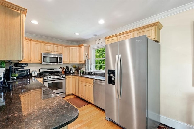 315 Bacon St Unit 1, Natick, MA 01760 - kitchen featuring stainless steel appliances, light brown cabinetry, crown molding, a sink, and light wood finished floors