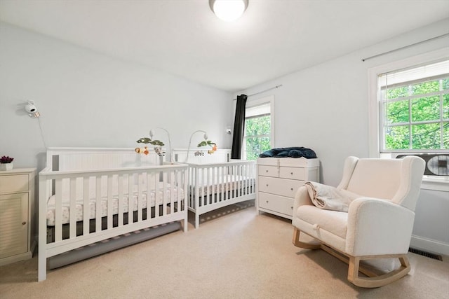 315 Bacon St Unit 1, Natick, MA 01760 - carpeted bedroom featuring a crib