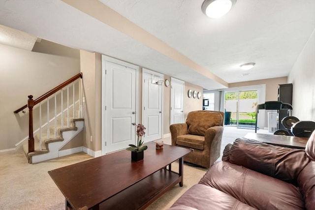 315 Bacon St Unit 1, Natick, MA 01760 - living room with light colored carpet, stairs, and baseboards